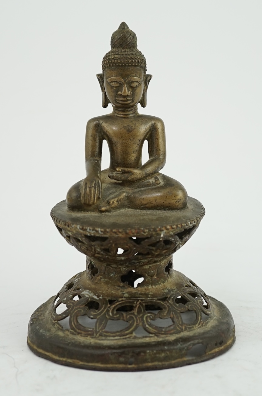 An unusual Burmese bronze seated figure of Buddha, 17th/18th century